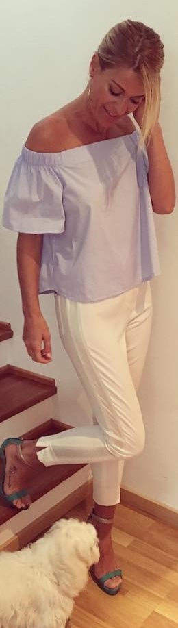 Off shoulder top and white pants outfit